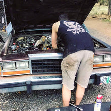 Load image into Gallery viewer, male working on car wearing tattoo style eagle and pinup tank top.