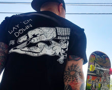 Load image into Gallery viewer, Tattooed male wearing tattoo style pinstripers hand and pinup on black shirt.