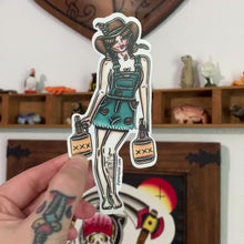 Load and play video in Gallery viewer, American traditional tattoo flash Hillbilly Moonshiner Pinup sticker.
