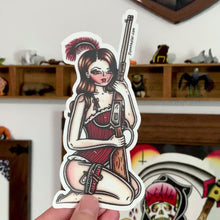 Load and play video in Gallery viewer, American traditional tattoo flash Rifle Saloon Girl Pinup watercolor sticker.
