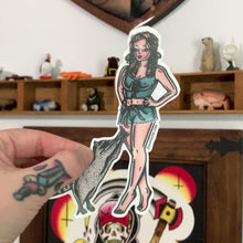 Load and play video in Gallery viewer, American traditional tattoo flash illustration Elly May Clampett and Critter country Pinup watercolor sticker.
