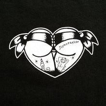 Load image into Gallery viewer, Tattoo style butt heart logo on black shirt.
