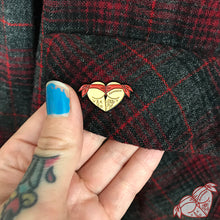 Load image into Gallery viewer, American traditional tattoo flash red scrunch butt bikini butt heart enamel pin on Pendleton pocket.
