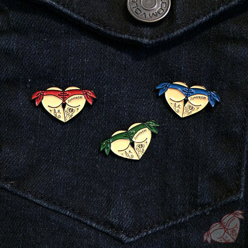 Butt Heart pin set of three  on denim vest.