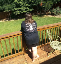 Load image into Gallery viewer, Female wearing tattoo style lady head shirt peering off backyard deck.
